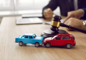 A lawyer conducting a deposition in a car accident case, with a witness providing sworn testimony in a formal setting.